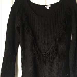 black knit sweater with fringe